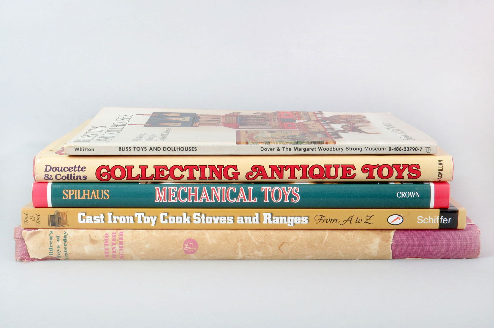 Lot of 5 Books about Toys and Antiques: 5 Books about Toys and Antiques: "Bliss Toys and Doll Houses"; "Collecting Antique Toys", Doucette/Collins; "Mechanical Toys", Spilhaus; "Cast Iron Cook Stoves and Ranges", Ford; "Children's Toys of Y