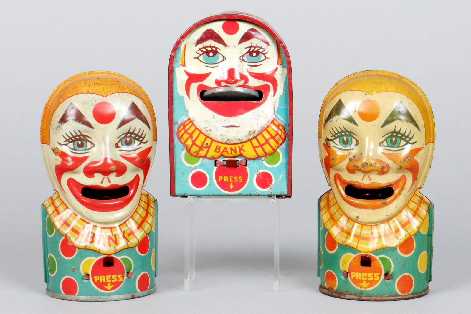 Lot of 3 Tin Clown Mechanical Banks: 3 Clown Mech. Banks, Tin: Chein Clown, marked "Bank", has round tin twist trap; English Clown "Bank", lock not working; Chein Clown, has KLT (older)