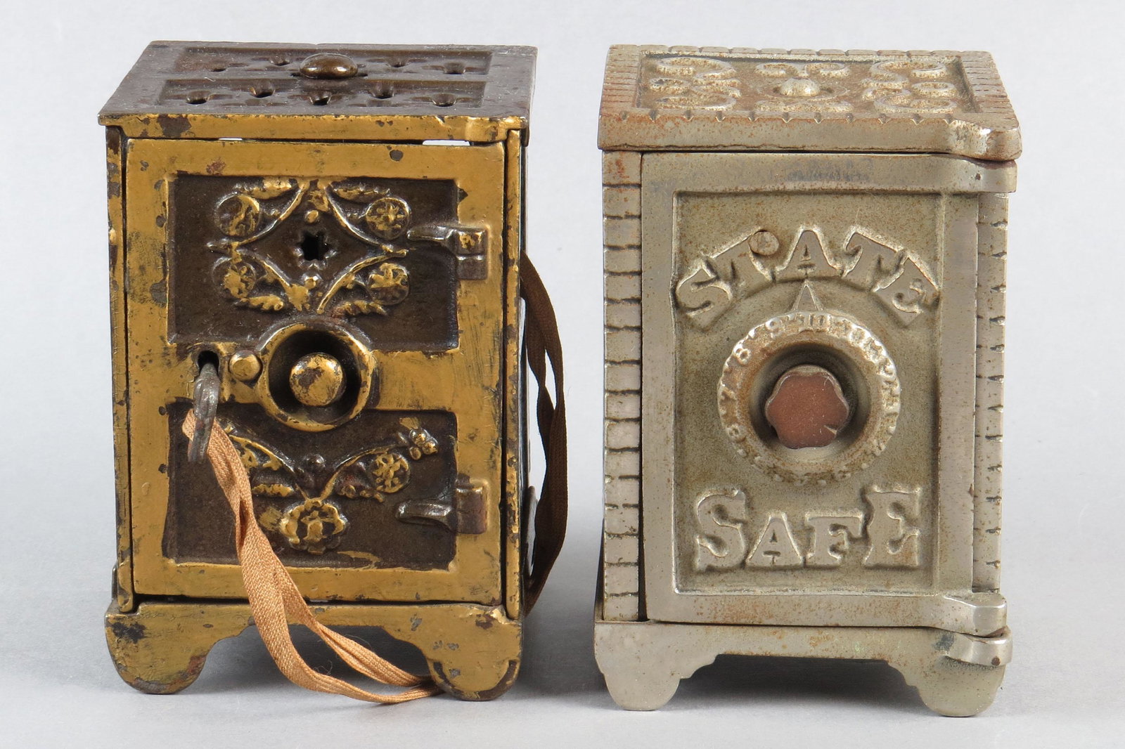 Lot of 2 CI Safe Banks: 2 Safe Banks, CI: "State Safe", Arched Letters w/CI Sides; Rosette Safe w/key