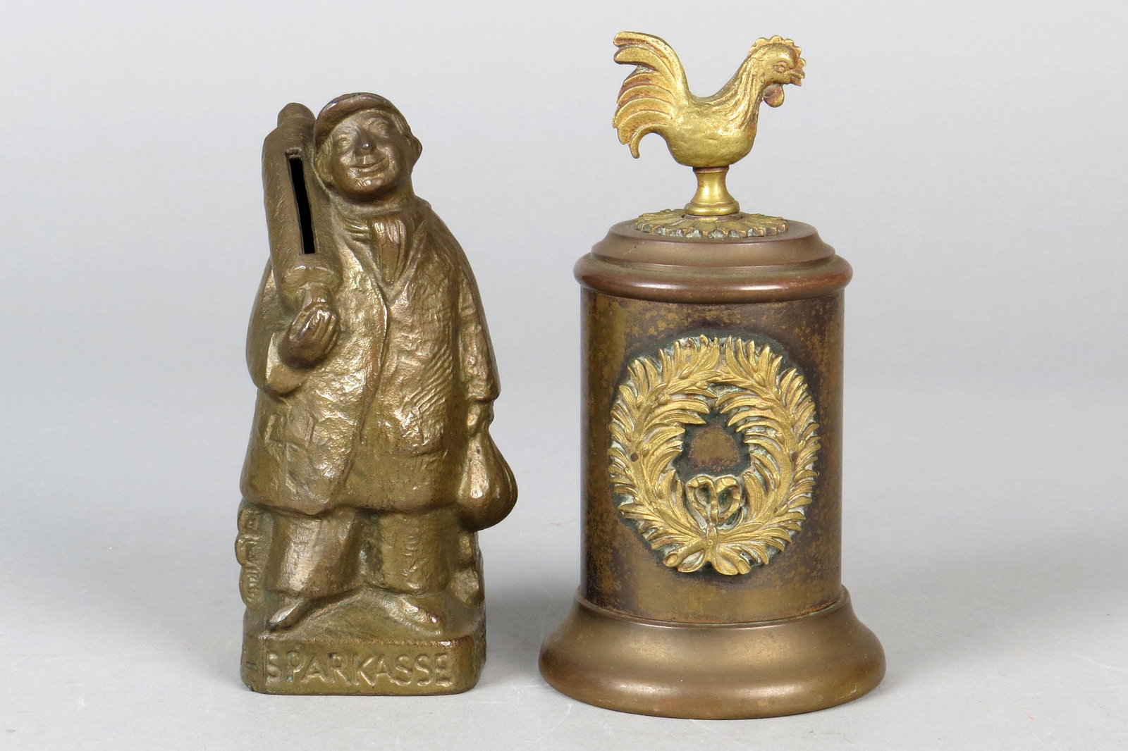Lot of 2 Lead/Brass Banks: 2 Banks, Lead/Brass: Baker with modern trap Rooster on Cylinder