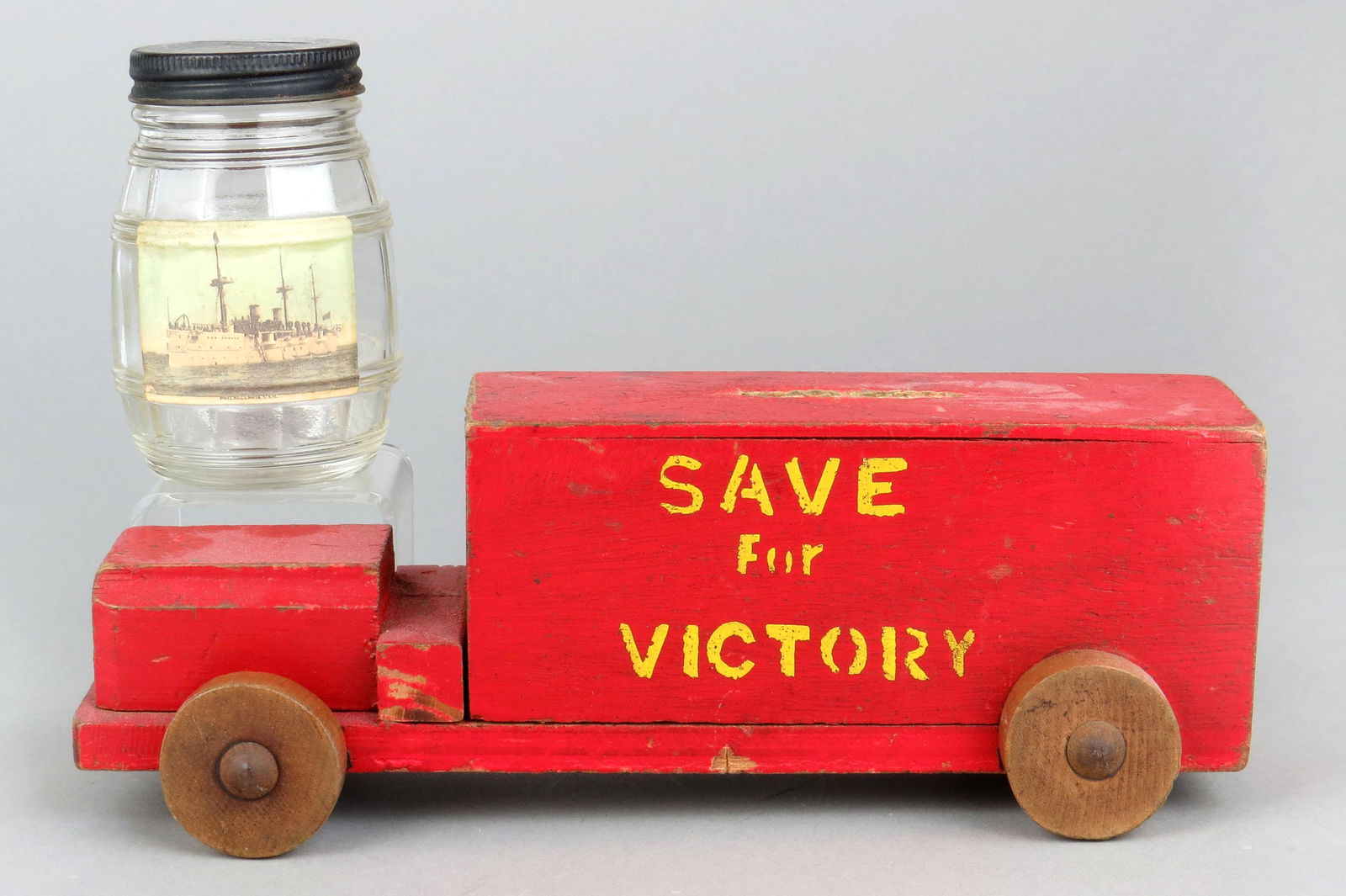 Lot of 2 Glass/Wood War Banks: 2 War Banks, Glass/Wood: "Battleship Mustard" Bottle w/Paper Picture of Battleship; "Save for Victory" Truck (English bank)