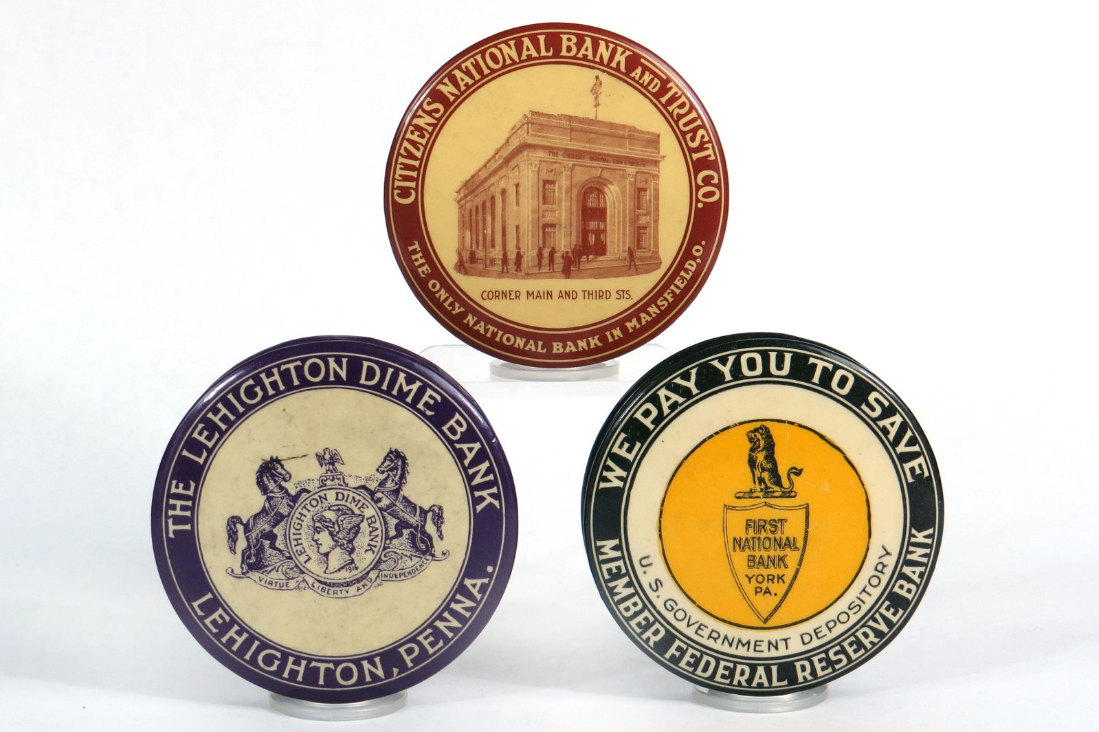 Lot of 3 Celluloid Pocket Banks: 3 Pocket Banks, Celluloid: "The Lehighton Dime Bank, Lehighton, Penna", Some staining on back; "Citizens National Bank and Trust Co., Mansfield, O"; "First National Bank, York, Pa"