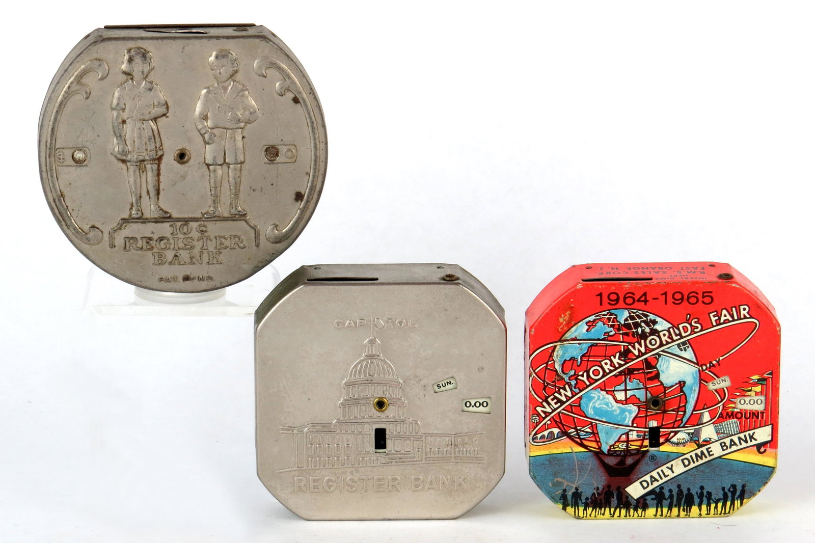 Lot of 3 Dime Register Banks: 3 Dime Register Banks, Tin: Girl and Boy "Register Bank"; "Capitol Register Bank"; "New York World's Fair Daily Dime Bank"