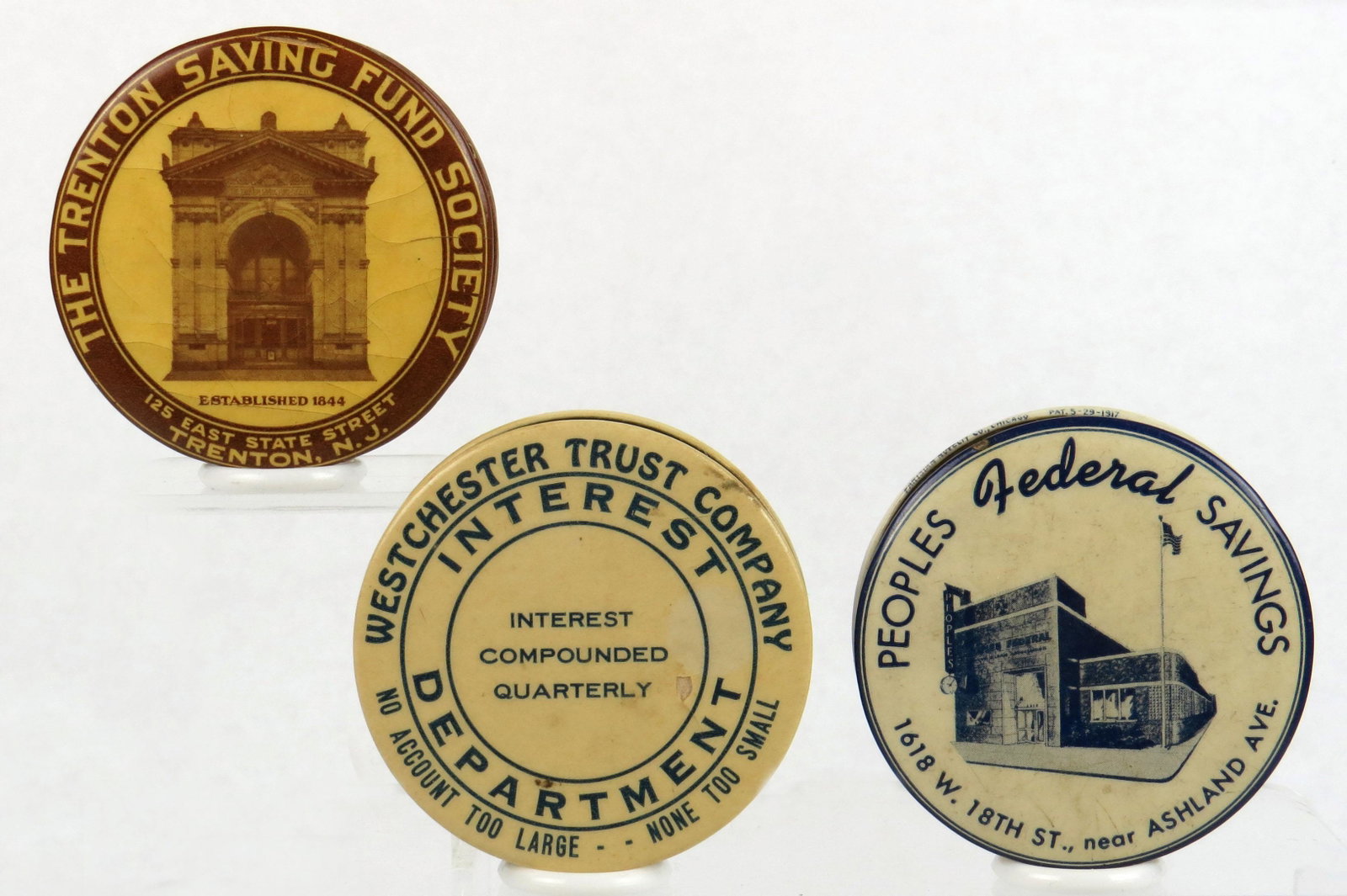 Lot of 3 Pocket Banks: 3 Pocket Banks, Celluloid: "The Trenton Saving Fund Society - Trenton, NJ", Cracking on front and back; "Westchester Trust Company"; "Peoples Federal Savings"