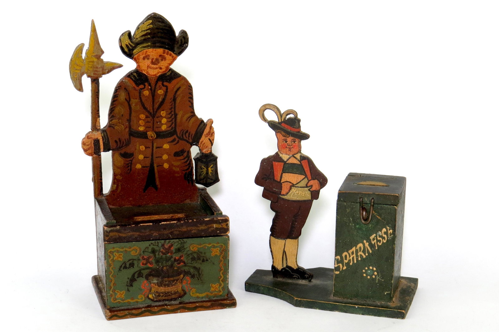 Lot of 2 Misc. Banks: 2 Misc. Banks, Wood: Man, Marked "Meran" - Wearing traditional German clothing, 6"; Night Watchman Carrying Lantern and Spear, Spear has been repainted, 7 3/8"