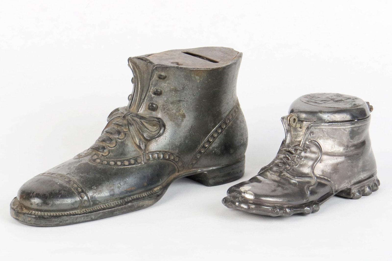Lot of 2 Shoe Banks: 2 Shoe Banks, Silvered lead: Larger, 3" high x 6" long; Smaller, 2" high x 4 1/4" long, Munich
