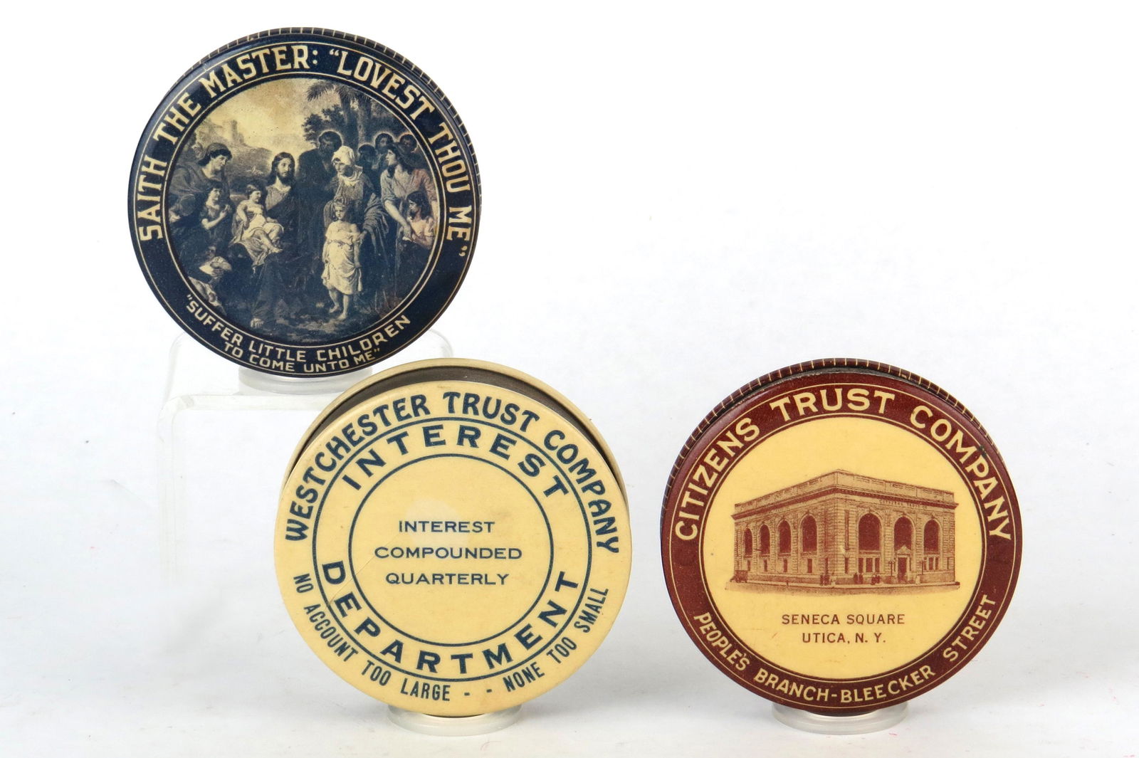 Lot of 3 Round Pocket Banks: 3 Round Pocket Banks, Celluloid: "Saith the Master: Lovest Thou Me"; "West Chester Trust Company": "Citizens Trust Company, Utica, NY"
