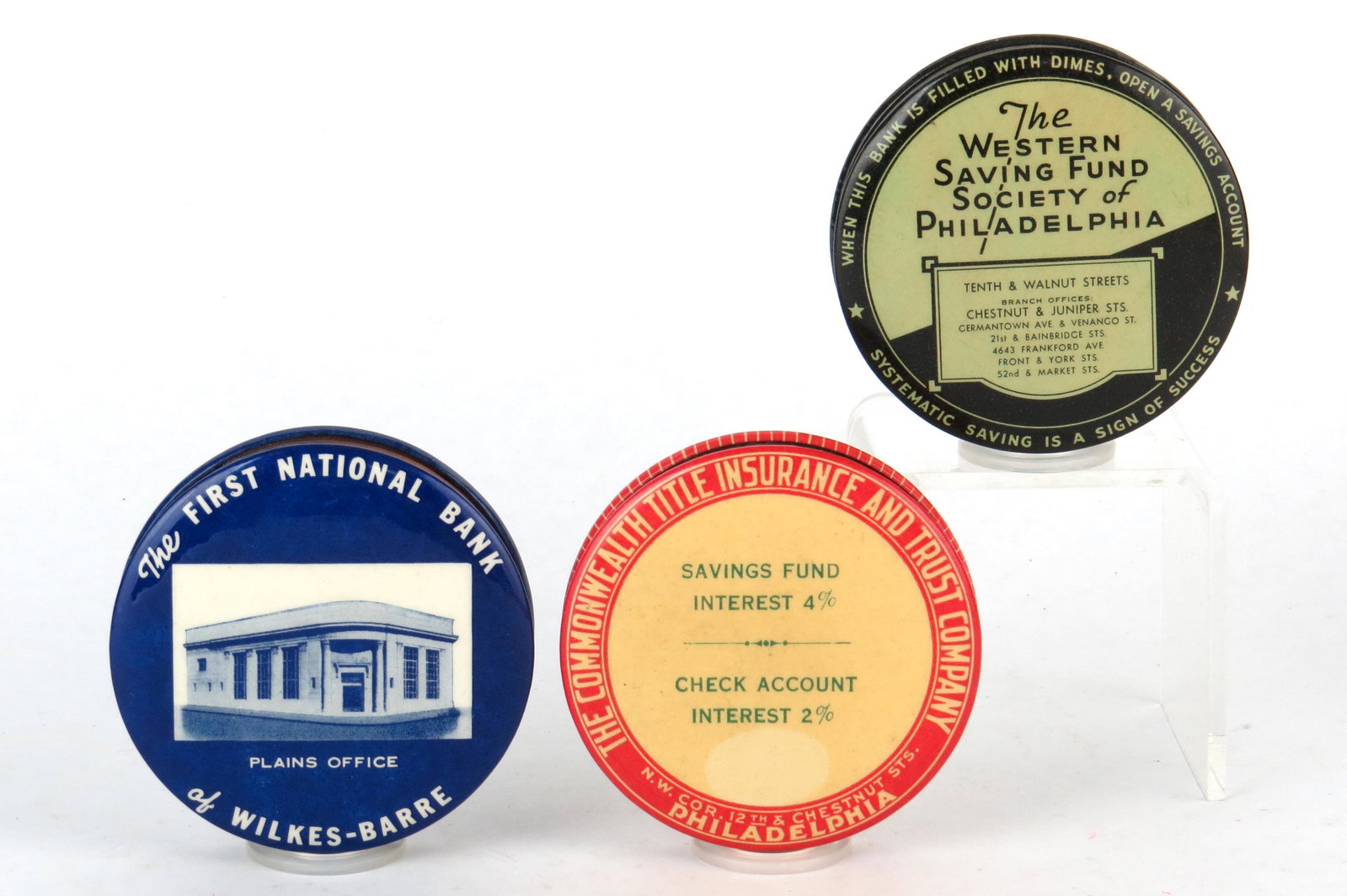 Lot of 3 Round Pocket Banks: 3 Round Pocket Banks, Celluloid: "The First National Bank of Wilkes-Barre"; "The Commonwealth Title Insurance and Trust Company, Philadelphia"; "The Western Saving Fund Society of Philadelphia"