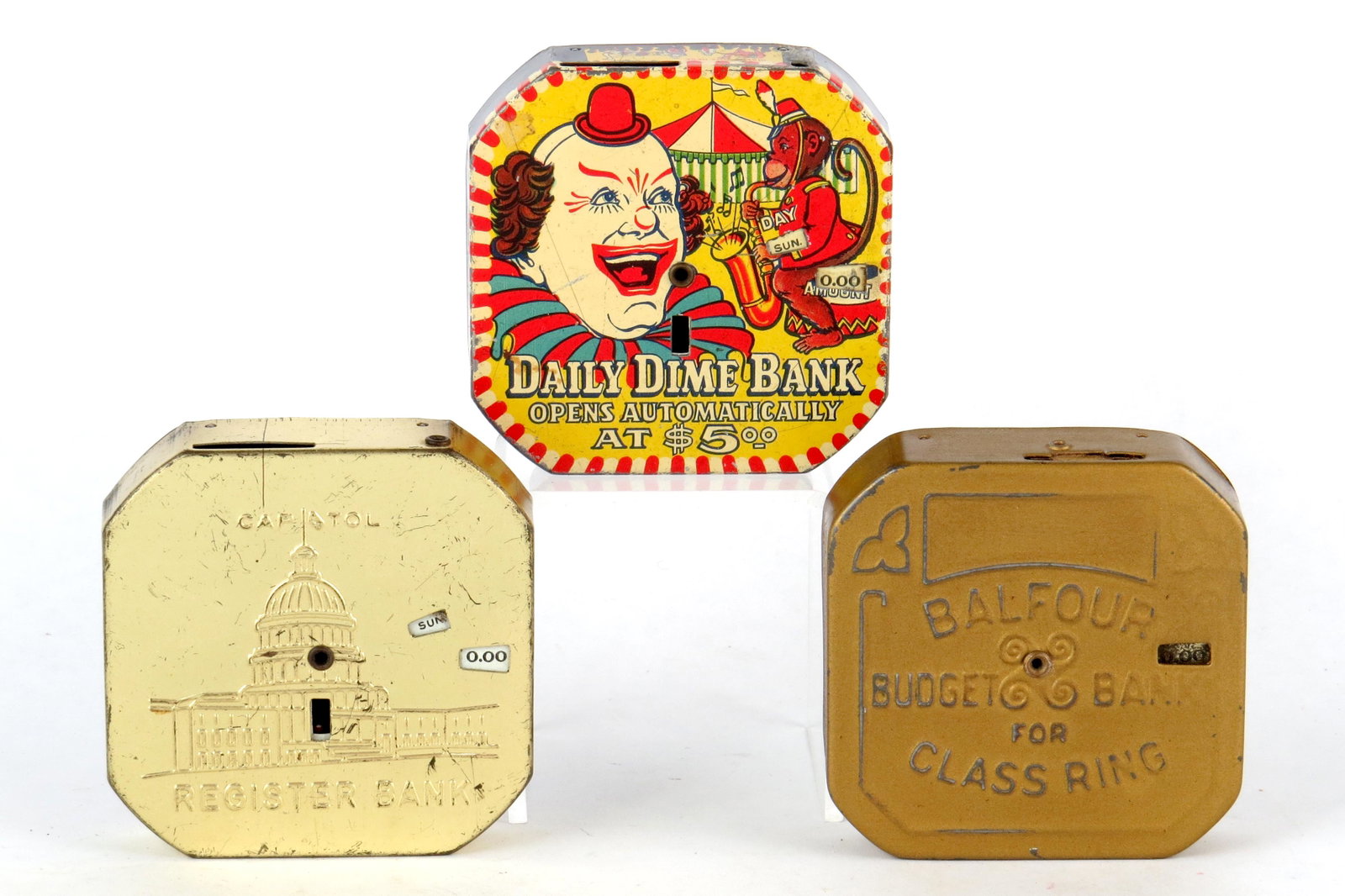 Lot of 3 Dime Register Banks: 3 Dime Register Banks, Tin: "Capitol Register Bank"; Clown "Daily Dime Bank"; "Balfour Budget Bank"