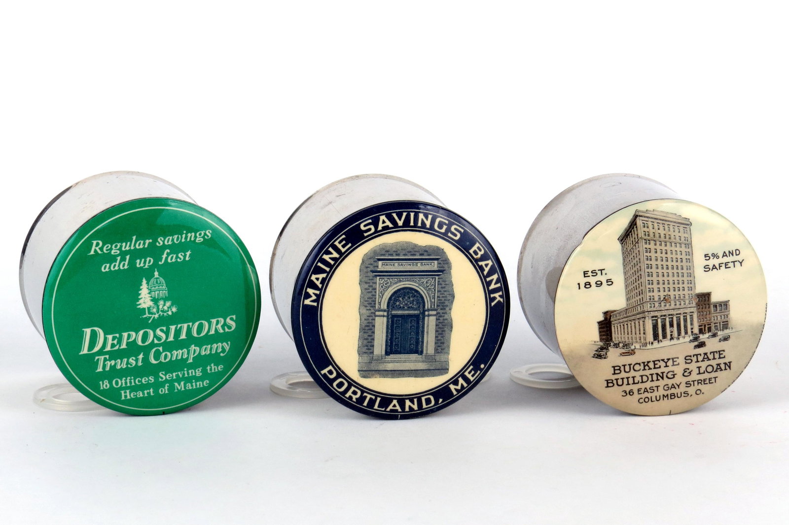 Lot of 3 Pocket Banks: 3 Pocket Banks, Celluloid/Sheet Metal: "Depositors Trust Company, Maine"; "Maine Savings Bank, Portland, ME"; "Buckeye State Building & Loan, Columbus, O'