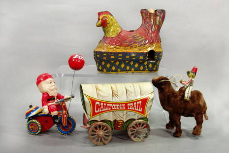 Lot of 4 Misc. Toys: Hen Laying Eggs; Covered Wagon; Santa on Tricycle; Camel w/Rider