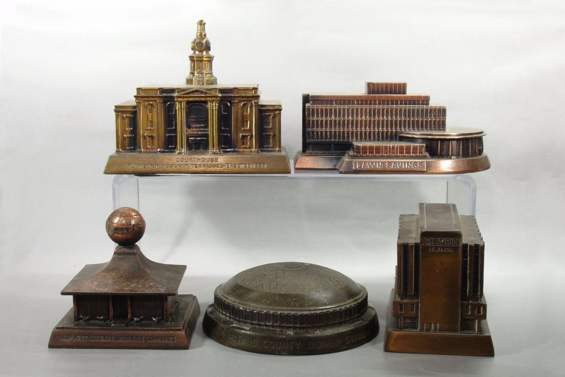 Lot of 5 Pot Metal Banthrico Building Banks: Midwest National Insurance Companies"; "Clyde Savings"; "Courthouse Rutherford County Tennessee"; "Lawn Savings"; "Harris County Domed Stadium