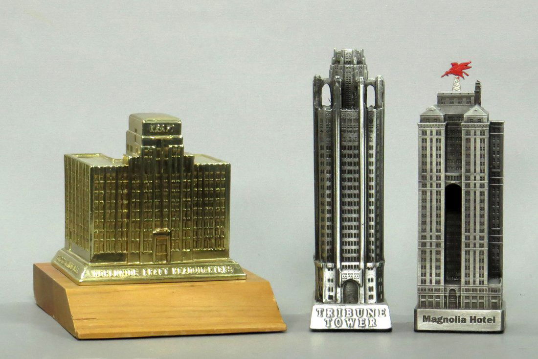 Lot of 3 Souvenir Buildings: 3 Souvenir Bldgs., lead and pewter: "Worldwide Kraft Headquarters Chicago Ill USA" on wood base, 4"; "Magnolia Hotel Dallas", 5"; "Tribune Tower Chicago", 5 1/4"