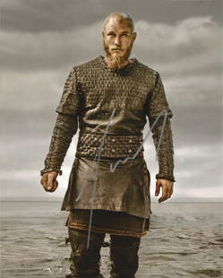 Travis Fimmel Vikings hand signed 10x8 photo. This: Travis Fimmel Vikings hand signed 10x8 photo. This beautiful hand signed photo depicts Travis Fimmel as Ragnar Lothbrok in the hit tv show, Vikings. This signed photo is guaranteed authentic and is su