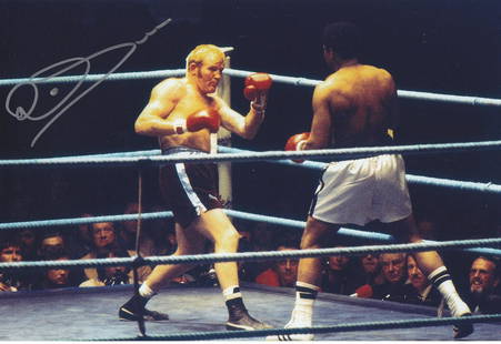Boxing Autographed RICHARD DUNN photo, a superb image: Boxing Autographed RICHARD DUNN photo, a superb image depicting Dunn in action against Muhammed Ali during their World Heavyweight Championship title fight in Munich in 1976, Dunn was knocked out by A