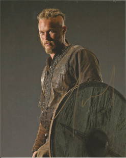 Travis Fimmel Vikings hand signed 10x8 photo. This: Travis Fimmel Vikings hand signed 10x8 photo. This beautiful hand signed photo depicts Travis Fimmel as Ragnar Lothbrok in the hit tv show, Vikings. This signed photo is guaranteed authentic and is su