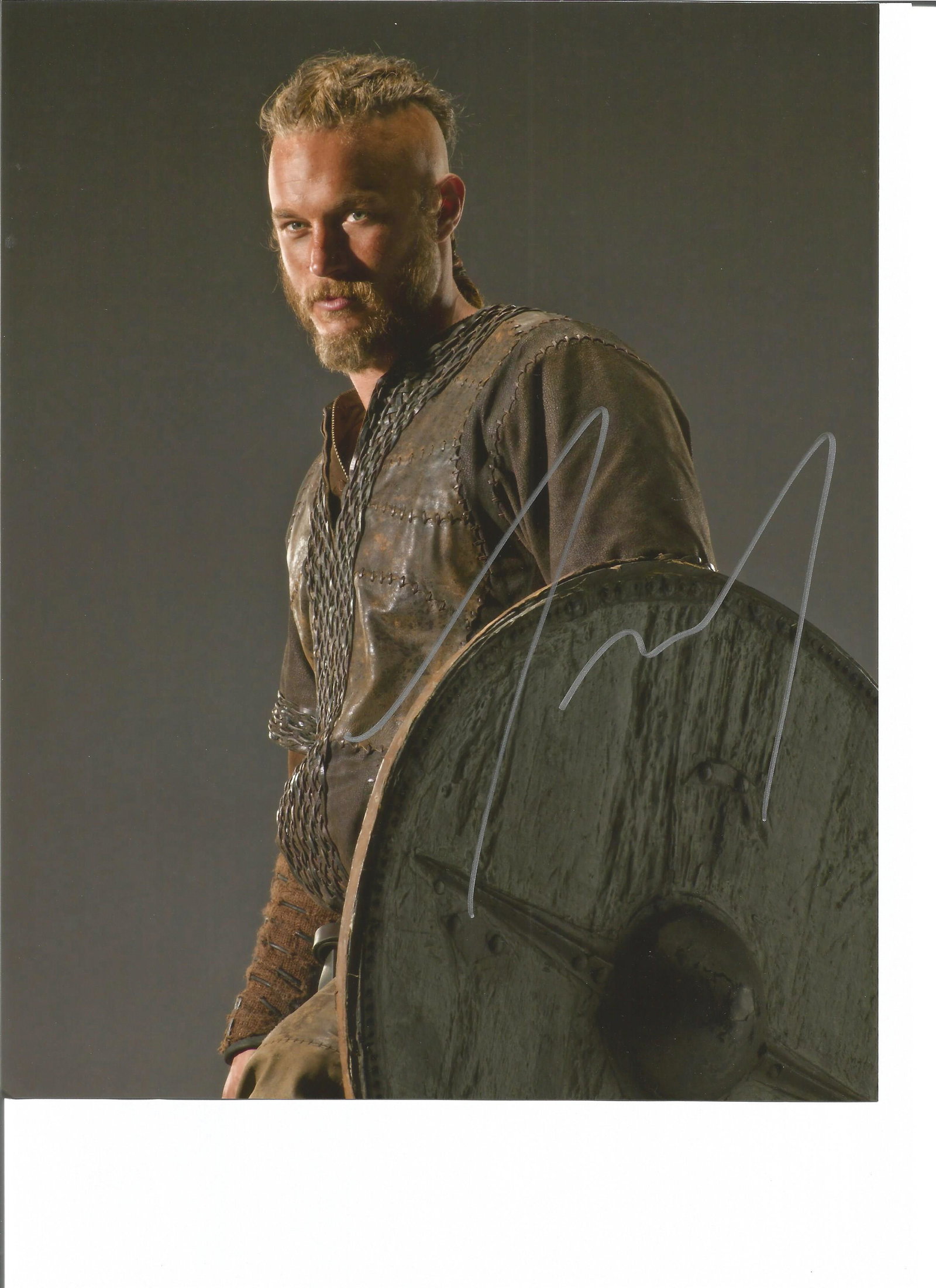 Travis Fimmel Vikings hand signed 10x8 photo. This: Travis Fimmel Vikings hand signed 10x8 photo. This beautiful hand signed photo depicts Travis Fimmel as Ragnar Lothbrok in the hit tv show, Vikings. This signed photo is guaranteed authentic and is su