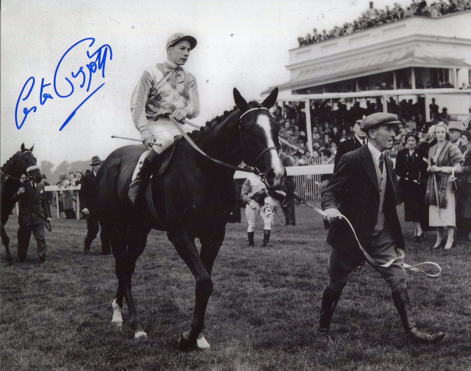 Lester Piggott. 8x10 inch photo signed by legendary: Lester Piggott. 8x10 inch photo signed by legendary jockey Lester Piggott, pictured on Never Say Die after winning the 1954 Epsom Derby. Good Condition. All signed pieces come with a Certificate of Au