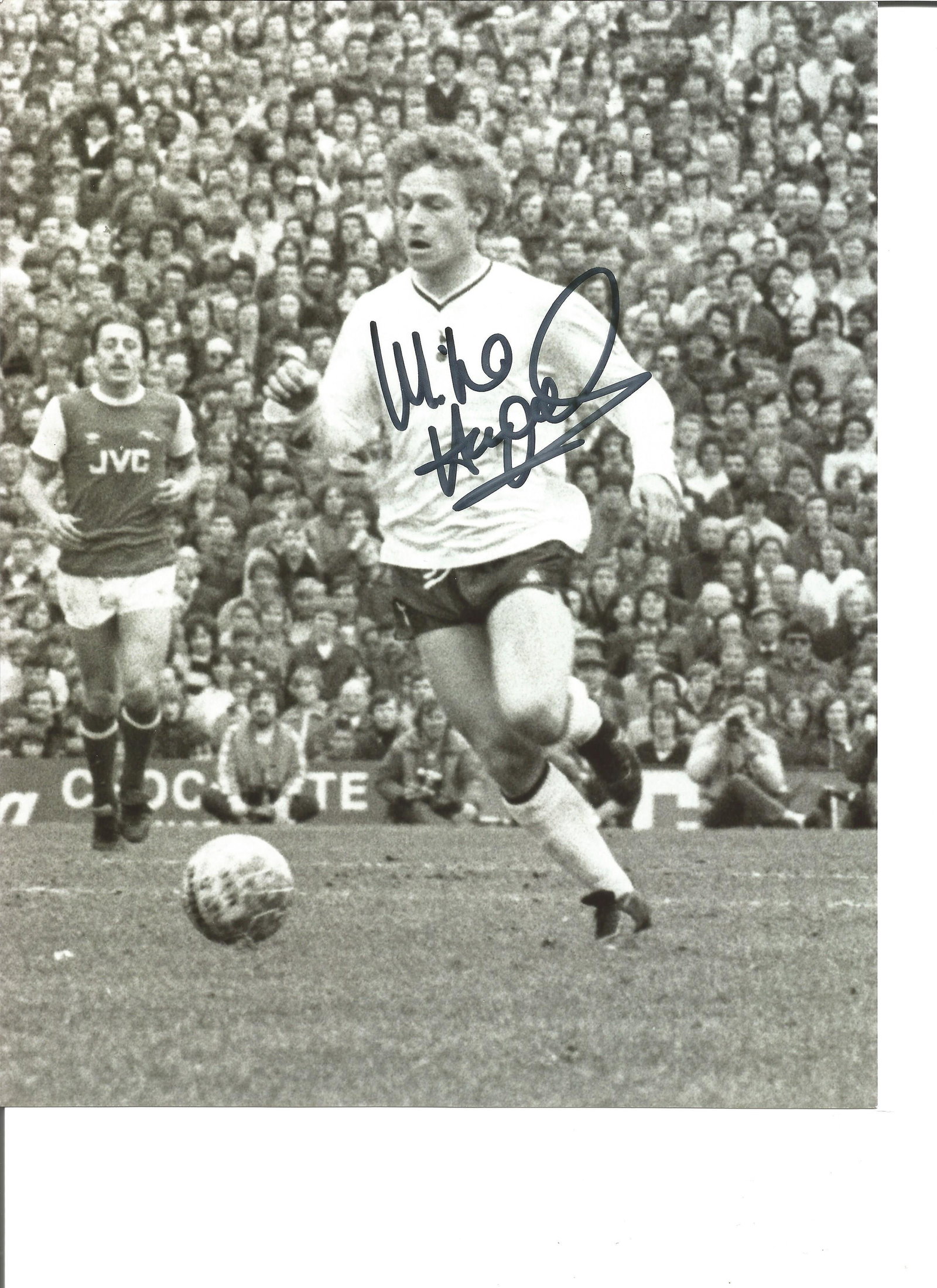 Micky Hazard 10x8 Signed B/E Photo Pictured In Action: Micky Hazard 10x8 Signed B/E Photo Pictured In Action For Spurs Against Arsenal In The North London Derby. Good Condition. All autographs are genuine hand signed and come with a Certificate of Authent
