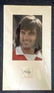 George Best signature piece mounted below colour photo.