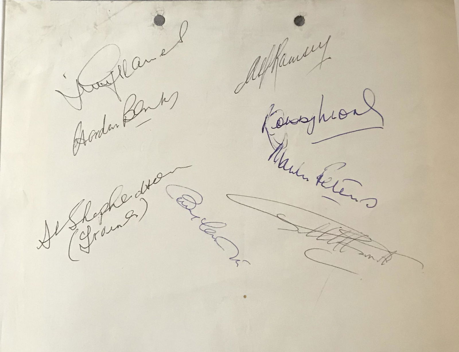1966 World Cup signed page inc Bobby Moore, Gordon: 1966 World Cup signed page. Signed by Bobby Moore, Gordon Banks, Alf Ramsey, Bobby Charlton, Geoff Hurst, Martin Peters, Jimmy Greaves, Harold Shepherdson. A little creasing and thin paper, but autogr