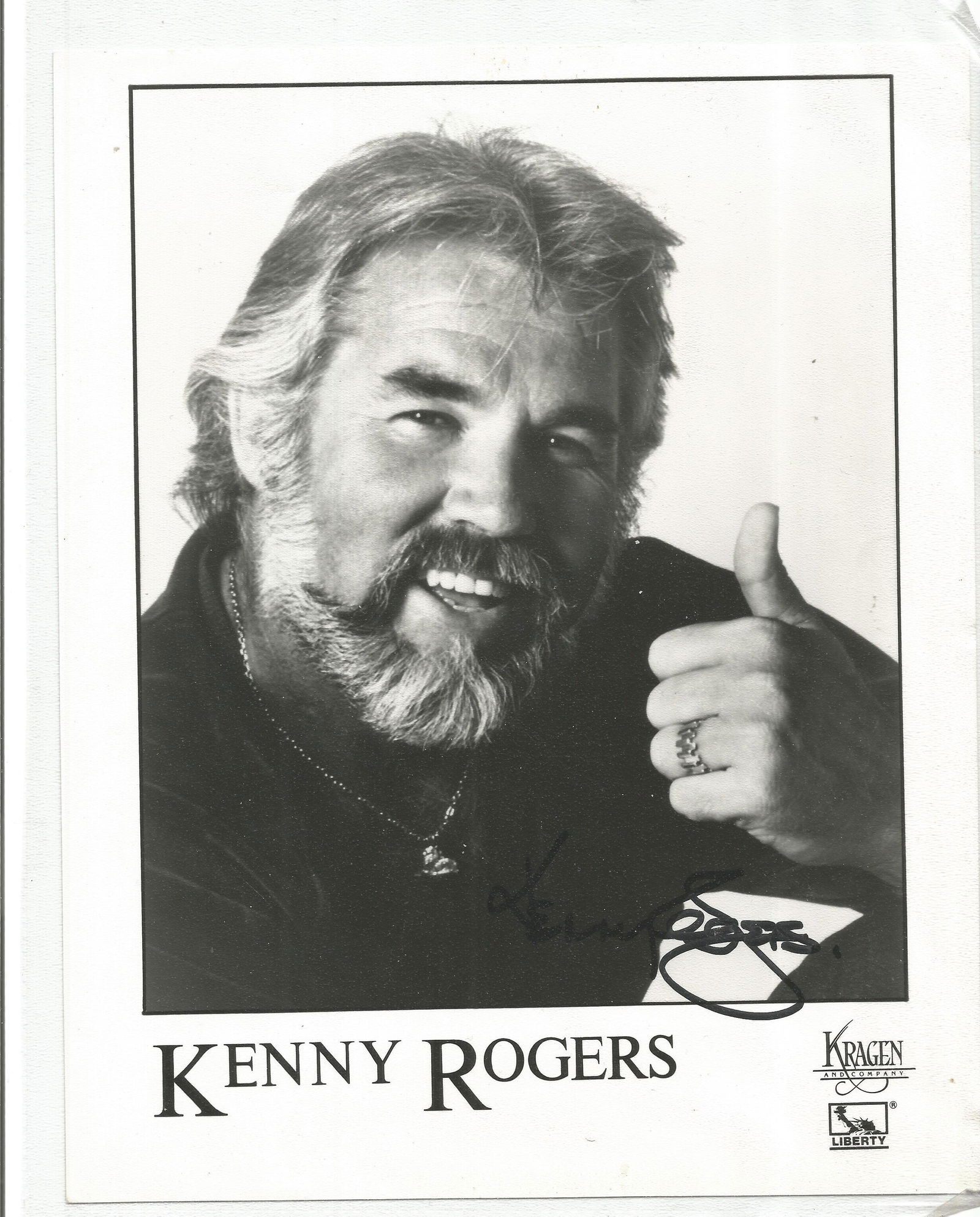 Kenny Rogers signed 10x8 black and white photo. Good (1 of 1)