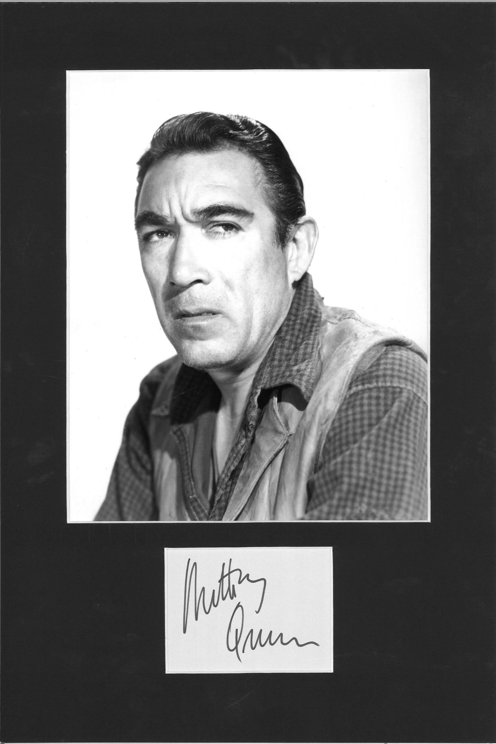 Anthony Quinn signature piece mounted below b/w photo.: Anthony Quinn signature piece mounted below b/w photo. Approx overall size 16x11. Good Condition. All autographs come with a Certificate of Authenticity. We combine postage on multiple winning lots an