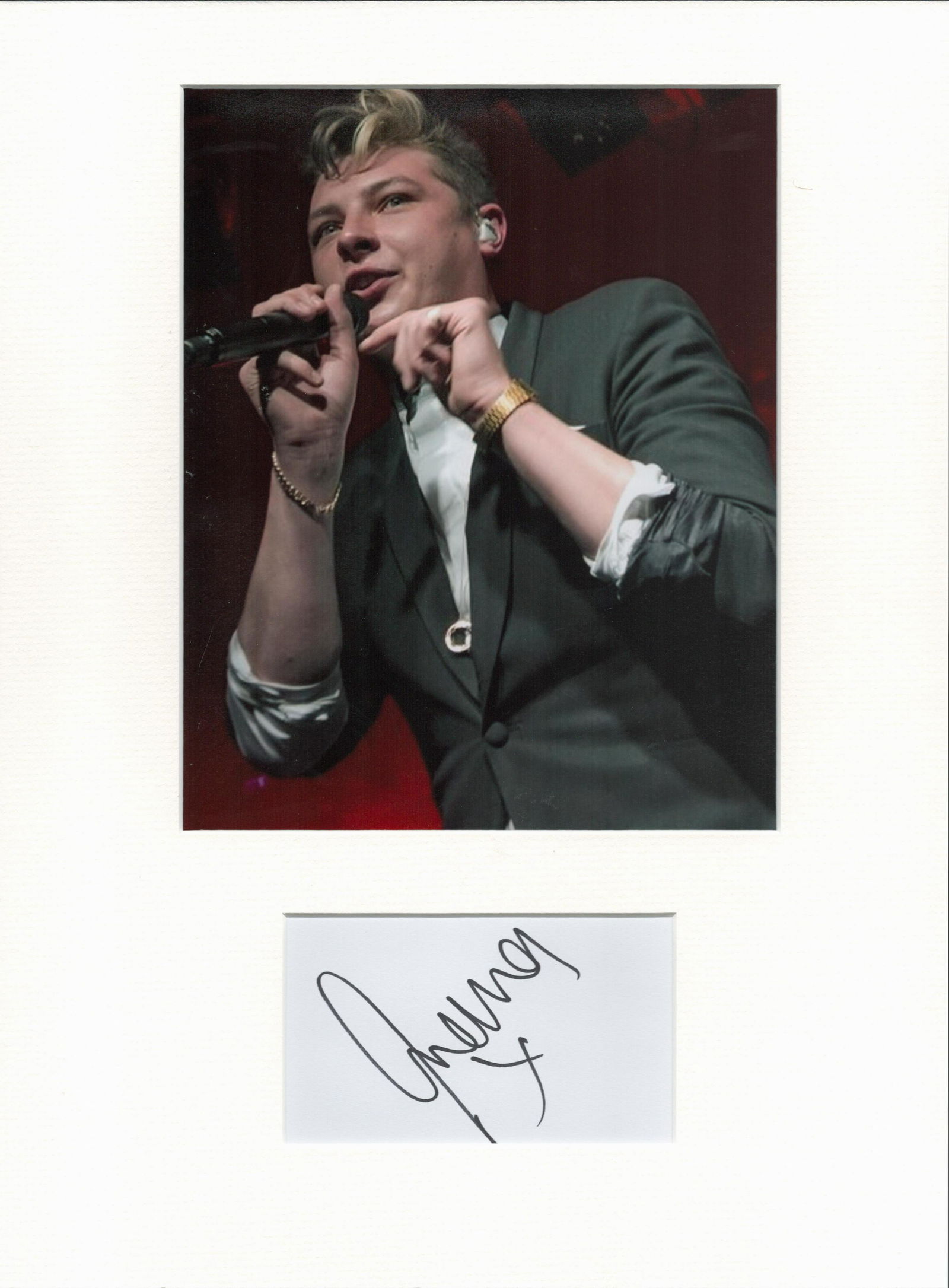 John Newman signature piece in autograph presentation.: John Newman signature piece in autograph presentation. Mounted with photograph to approx. 16 x 12 inches. Good Condition. All autographs are genuine hand signed and come with a Certificate of Authenti