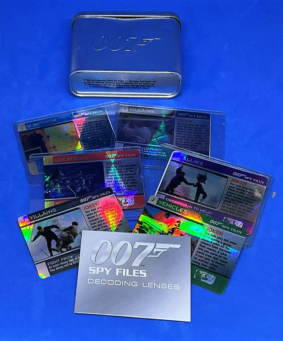 James Bond Collection 6 Spy Files Joker Trading Cards: James Bond Collection 6 Spy Files Joker Trading Cards and Decoding Lenses housed in a 007 metal display cannister. Good condition. All autographs come with a Certificate of Authenticity. We combine po
