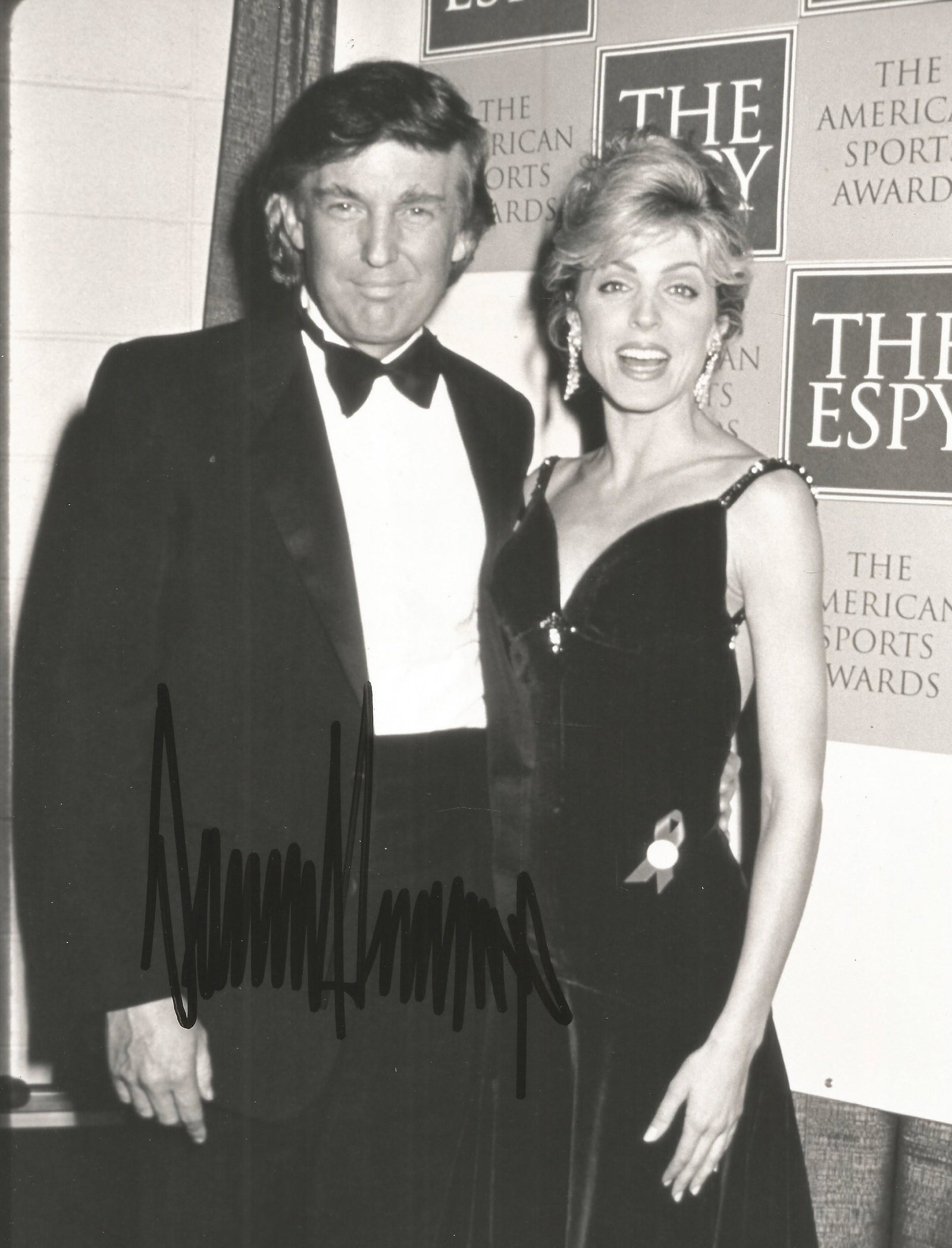 Donald Trump signed 10x8 black and white photo. An: Donald Trump signed 10x8 black and white photo. An original Tom Wargacki photo hand signed by Donald Trump in 1993 pictured with his second wife of six years the actress Marla Maples. Good condition.