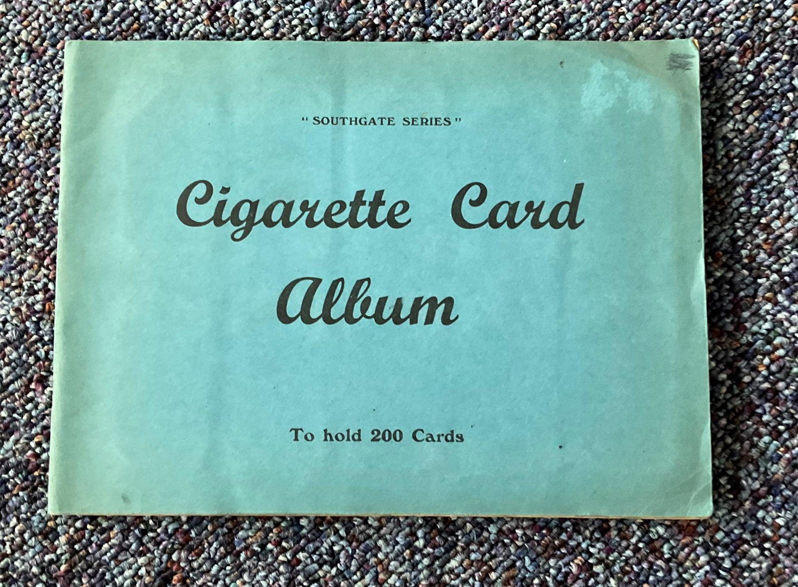 Cigarette card collection in album. Includes 1938 (1 of 1)