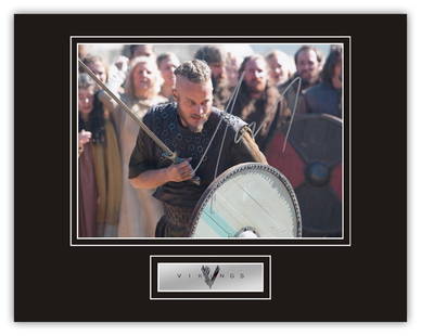 Stunning Display! Vikings Travis Fimmel hand signed professionally mounted display. This beautiful: Stunning Display! Vikings Travis Fimmel hand signed professionally mounted display. This beautiful display consists of a 10x8 photo, hand signed by Travis Fimmel as Ragnar Lothbrook in the smash hit t