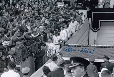 Autographed GRAHAM WILLIAMS 12 x 8 photo B/W, depicting the West Brom captain descending the: Autographed GRAHAM WILLIAMS 12 x 8 photo B/W, depicting the West Brom captain descending the famous steps at Wembley, FA Cup in hand, after being presented with the trophy following his side's 1 0 vic