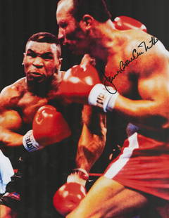 Boxing James Bonecrusher Smith signed 16x12 colour photo pictured during his fight with Mike: Boxing James Bonecrusher Smith signed 16x12 colour photo pictured during his fight with Mike Tyson. Good condition. All autographs come with a Certificate of Authenticity. We combine postage on multip