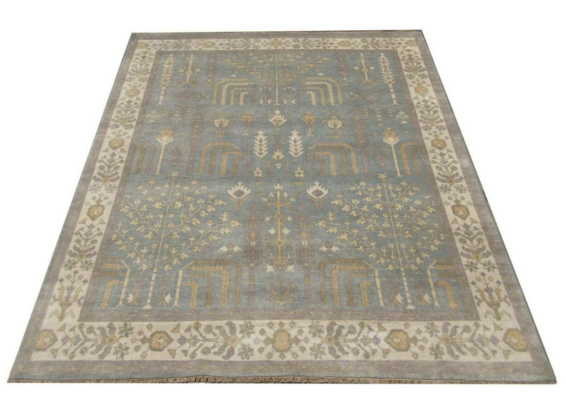 8X10 Blue Oushak Hand-Knotted Rug: Hand-knotted wool pile on a cotton foundation. Dimensions: 8'3" x 9'10" Origin: India Field Color: Blue Border Color: Ivory Accent Colors: Gray, Brown, Gold Note: Photos are as a