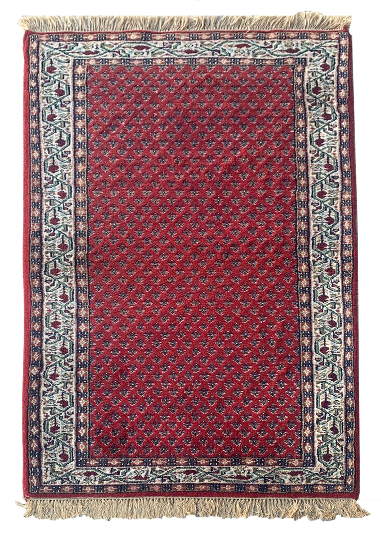 3X5 Saraband Estate Rug: Hand-knotted wool pile on a cotton foundation. 2010 Dimensions: 3'1" x 5'4" Origin: India Condition: Excellent for its age Field Color: Cherry-Red Border Color: Ivory Accent Colors: Brown, Green SKU: 