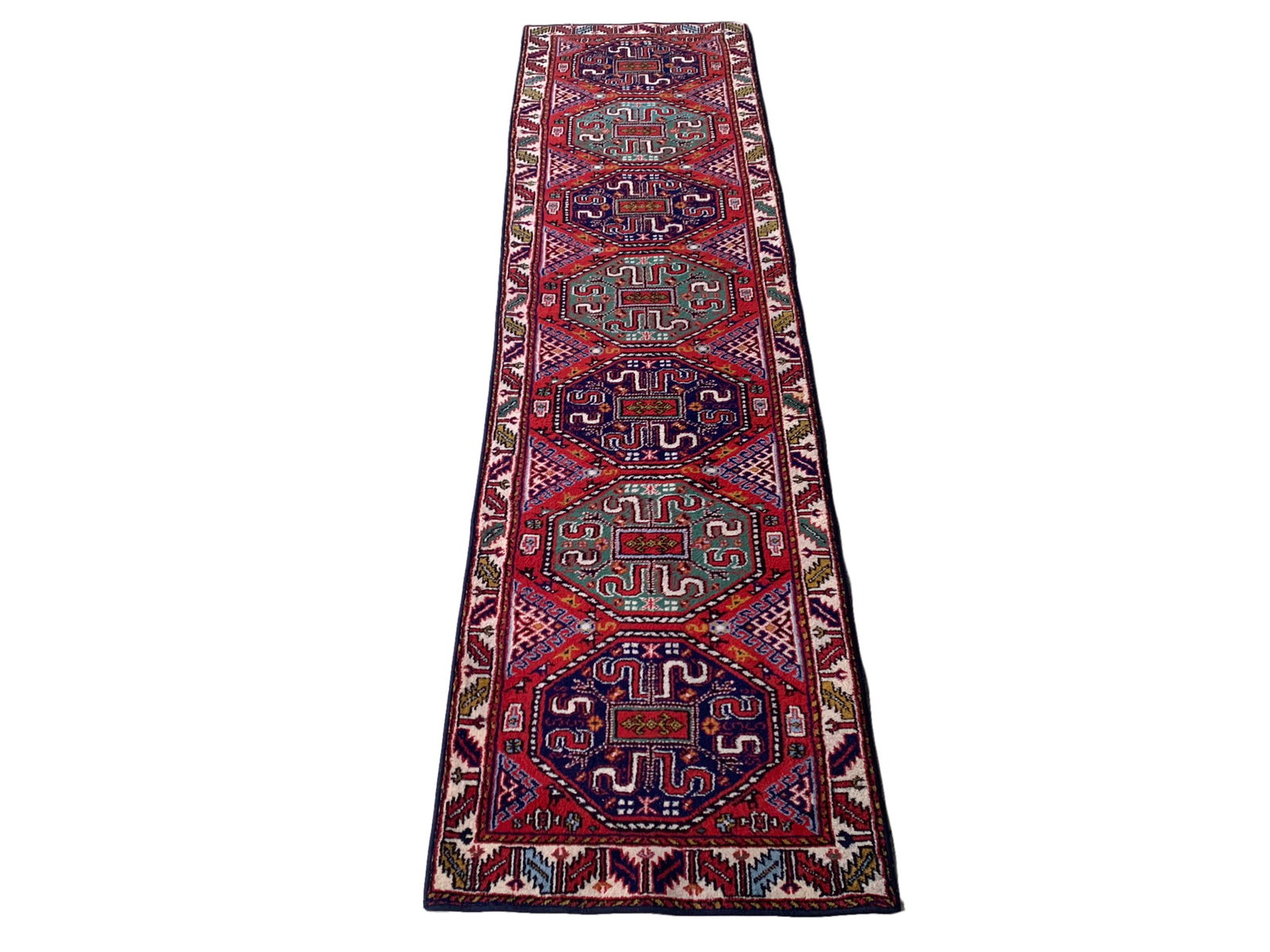 3X12 Estate Kazak Runner, Circa 1960: Hand-knotted wool pile on a cotton foundation. Circa 1960 Dimensions: 2'11" x 10'10" Origin: Turkey Condition: Excellent Field Color: Red Border Colors: Ivory Accent Colors: Light-Green, Navy, Gold SK