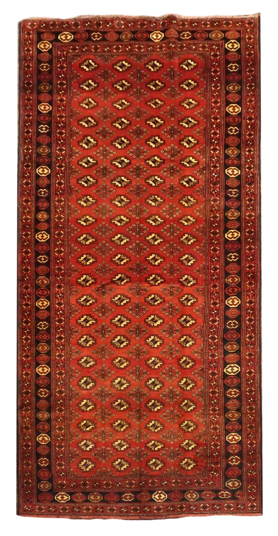 5X13 Tribal Baluchi Bukhara Gallery Runner, circa 1940: Hand-knotted, abrash wool pile on a cotton foundation. Circa 1940 5'5" x 12'10" Origin: Iran Condition: Excellent Field Color: Rust-Red Border Color: Black Accent Colors: Burgundy, Ivory, Gold, Khaki 