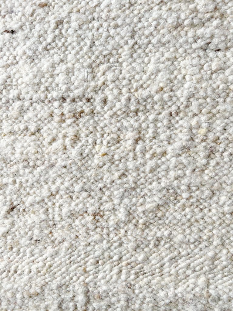 8X10 Natural Raw Wool Flatweave Hand-Knotted Rug: Hand-knotted, flatweave raw wool. Size: 8X10 New Origin: India Field Colors: Ivory Accent Colors: Brown, Beige SKU: 90.05-07.08.22-8X10-AN052-ETMK