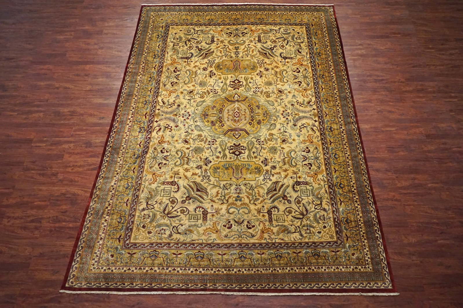10X14 Fine Persian Tabriz Rug: Hand-knotted wool pile on a cotton foundation. New Dimensions: 9'9" x 14' Origin: Iran Condition: Excellent Field Color: Light-Gold Border Color: Gold Accent Colors: Light-Blue, Burgundy, Ivory SKU: 6