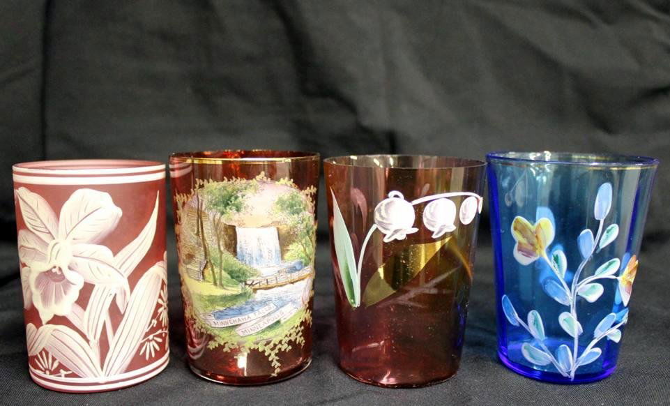 4 Antique Art Glass Enameled Tumblers: Cranberry Florentine Art Company Enameled Floral Tumbler. Minnehaha Falls enameled Ruby Red with gold gilt rim. Cranberry Mary Gregory style enameled & Gilt tumblers with floral decoration. Blue Ename