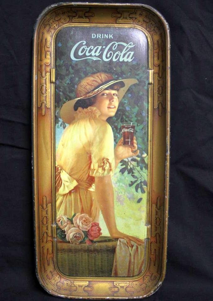RARE 1916 Coca-Cola Serving Tray Original: an original not reproduction antique 1916 RARE Coke Advertising Serving Tray. Beautiful young woman on wicker seat with flowers. Drink Coca Cola slogen. Gorgeous Border. Signed on the lower bottom edg