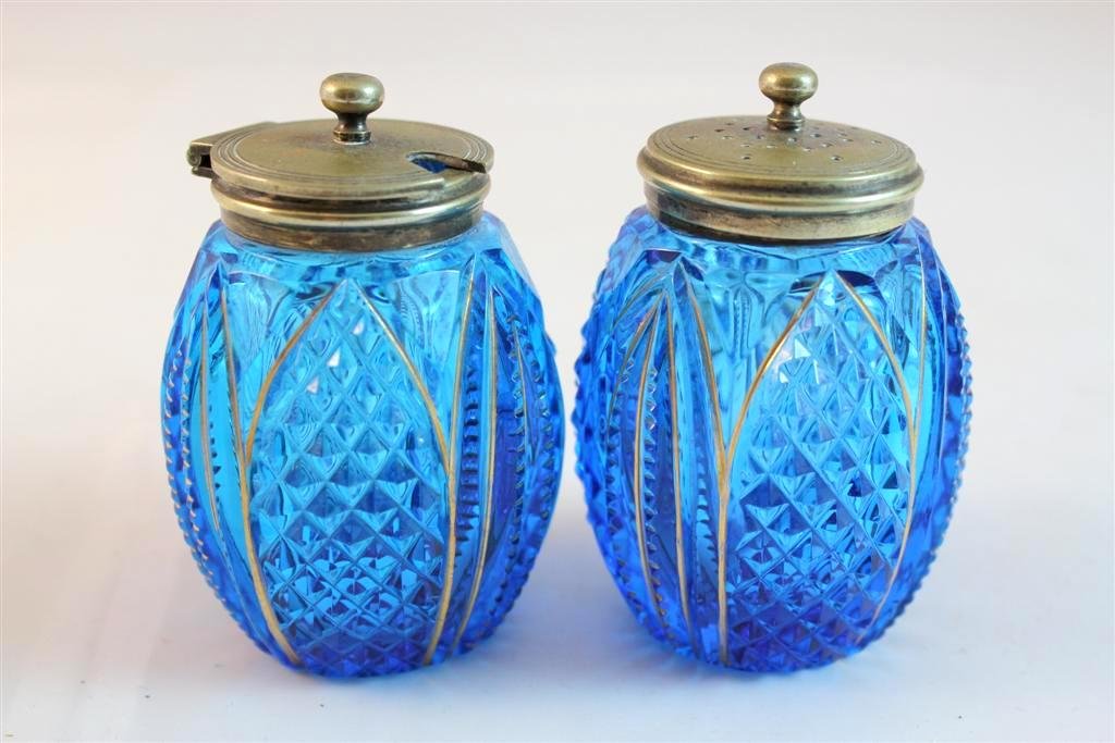Brilliant Cut Glass Blue Gilt Shaker & Condiment: A gorgeous matched pair of Brilliant Cut Glass Blue Salt or pepper shaker with matching Condiment jar. Both have gold gilt lines. Sharp cut to the glass. Electroplated lids. Unmarked. Moser style glas