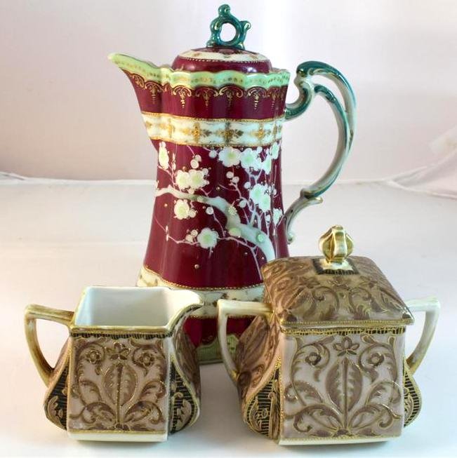 Nippon Noritake Cream & Sugar Chocolate Pot: A beautiful RARE matched set of Cream & Sugar. Circa 1900 Noritake Nippon porcelain by Morimura Brothers. Golt Gilt Square form bodies also hand painted. Included is an unmarked late 1800's Nippon cho