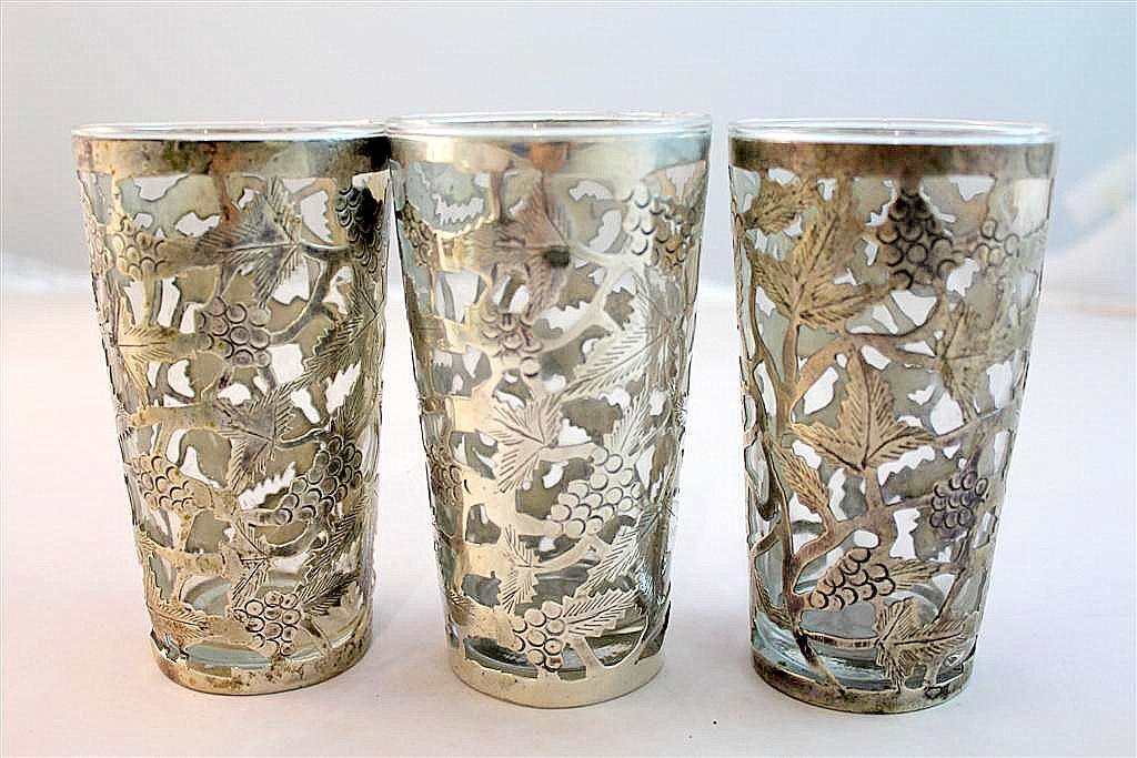Sterling Silver overlay tall drink glasses: a set of three clear glasses with great sterling silver reticulated design overlay made of 925 silver. Measures 5” by 2-1/2”