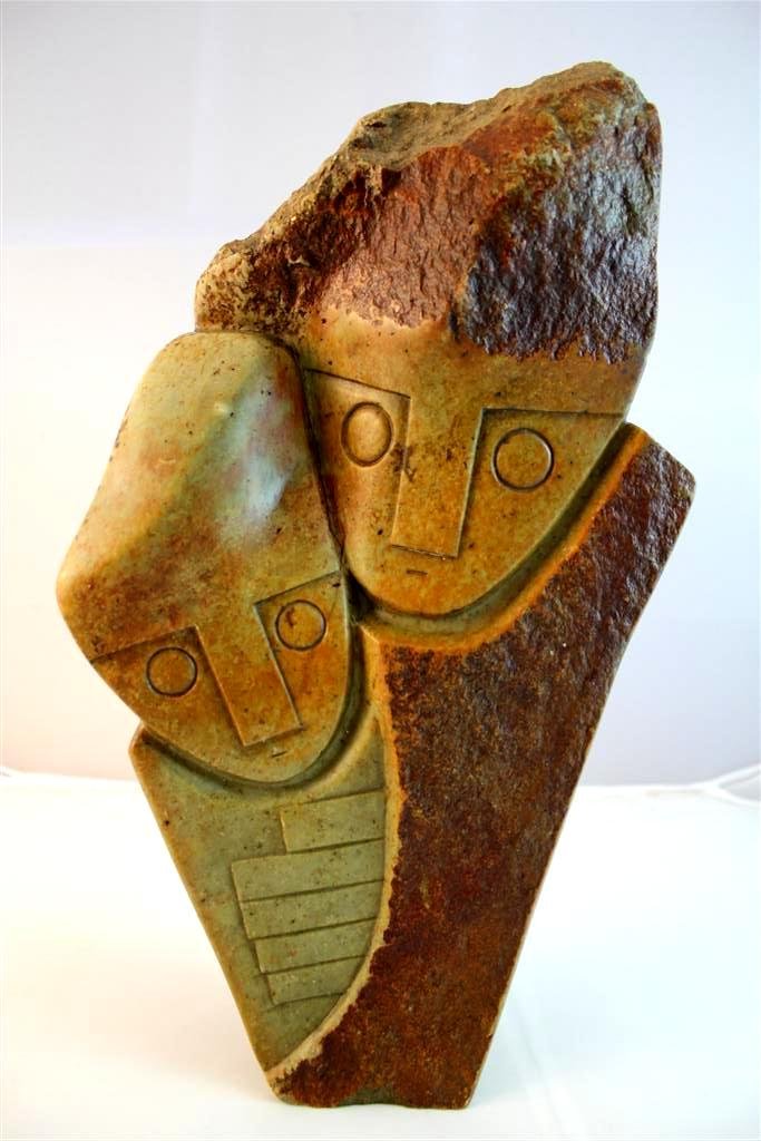 Henry Munyaradzi Zimbabwe 1931-1998 Sculpture: a RARE large double figured stone hand carved sculpture by Zimbabwe artist Henry Munyaradzi 1931-1998. A green & brown toned stone sculpture in a Modernist form with two stylized figures on it. Signed