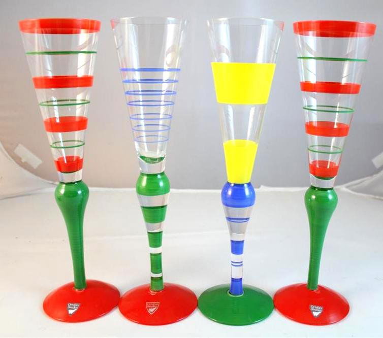 Orrefors Anne Nilsson Champagne Flutes: set of 4 hand painted Orrefors crystal glass Champagne Flutes. Designed & signed by Anne Nilsson. All four in a striped pattern called Clown. All labeled and signed by the artist. Measure 10-1/2” ta