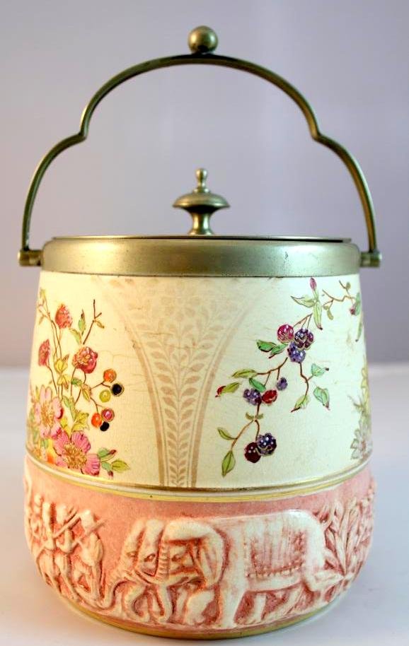 Wedgwood RARE Biscuit Jar figures elephants: A greta antique 19th Century Wedgwood England porcelain biscuit or cracker jar. Hand enamel painted with floral design in polychrome. A great high relief scene around the lower edge of a large chariot