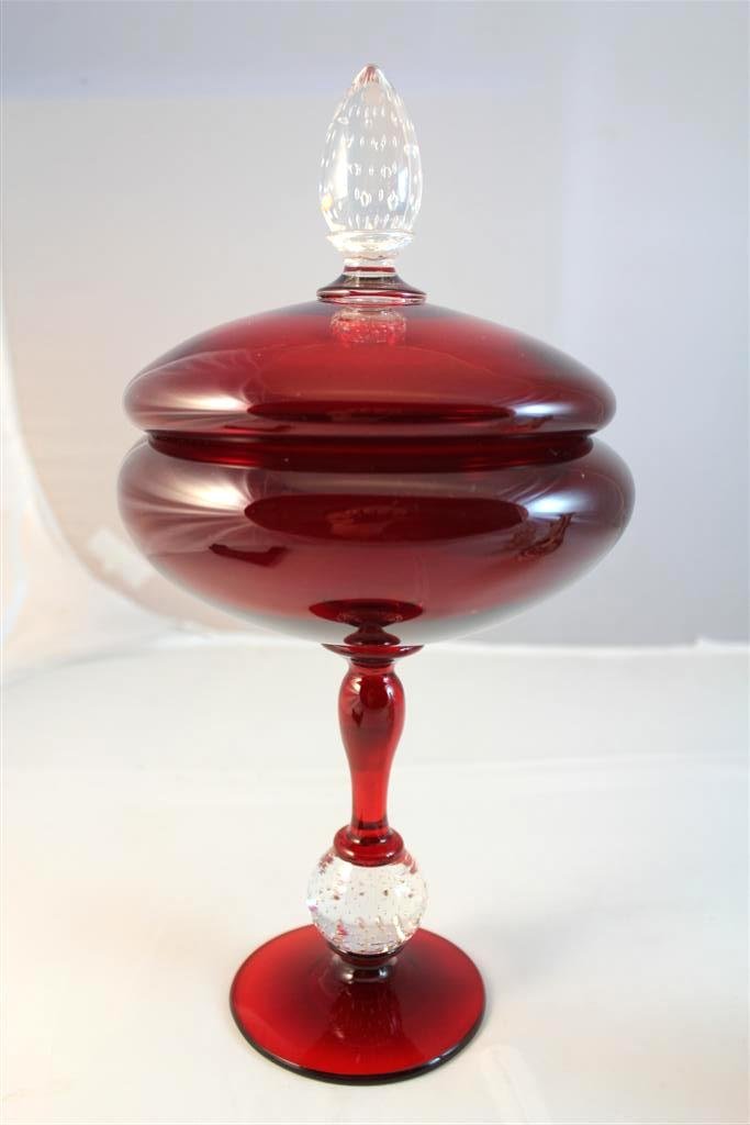 Pairpoint Ruby Bubble covered compote dish: A beautiful antique Pairpoint glass company covered compote. A tall version measuring 12” by 6”. riby red colored glass with a controlled bubble glass ball on the stem and finial of lid. Very high