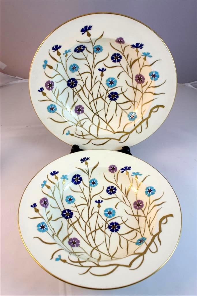 RARE Enameled Mintons Wild Flower Bowls: A set of two beautiful antique Mintons hand enamel painted edged soup bowls. Beautifully hand painted with heavy paint floral decoration in classic mintons colors. Along with heavy gold gilt decoratio